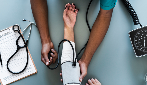 a person having their blood pressure taken